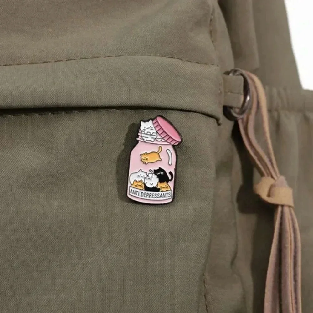 Pink multicolor kitty cats in medicine bottle antidepressants enamel pin bag hat